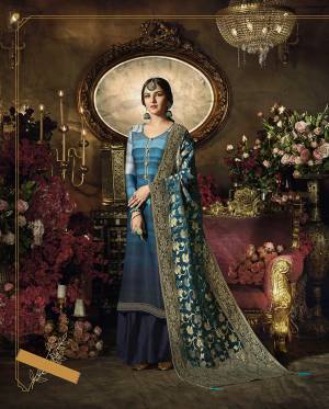 Go With The Shades Of Blue With This Designer Suit In Shaded Blue Colored Top Paired With Navy Blue Colored Bottom And blue Colored Dupatta, Its Top Is Satin Georgette Based Paired With Santoon Bottom And Banarasi Art Silk Dupatta. Get This Stitched As Per Your Desired Fit And Comfort. 
