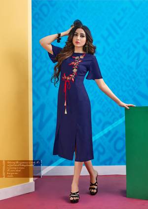 Grab This Designer Readymade Kurti In Navy Blue Color With A Very Pretty Bell Sleeve Pattern. This Kurti IS Fabricated On Rayon Beautified With Contrasting Colored Thread Work. 