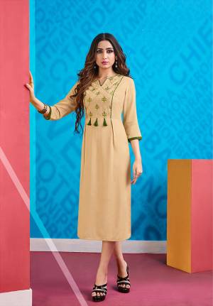 Simple And Elegant Looking Readymade Kurti In Here In Beige Color Fabricated On Rayon. It Is Beautified With thread Work Over The Yoke. Buy Now.