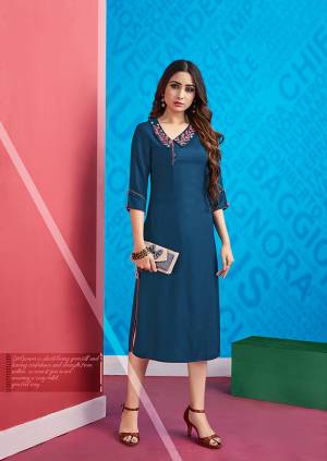 New Patterned Designer Readymade Kurti Is Here In Blue Color Fabricated On Rayon. It Is Beautified With Contrasting Colored Thread Work Over The Collar. 