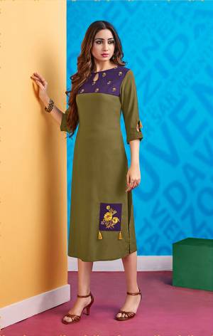 One Of The Most Running Shade Is Here With This Readymade Kurti In Olive Green And Violet Color. This Kurti Is Fabricated On Rayon Which Is Soft Towards Skin And Easy To Carry All Day Long. 