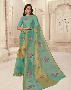 Here Is A Very Pretty Designer Saree In Turquoise Blue Color Paired With Turquoise Blue Colored Blouse. This Saree Is Fabricated On Brasso Paired With Art Silk Fabricated Blouse. It Has Contrasting Thread Work Over The Saree And Blouse. 