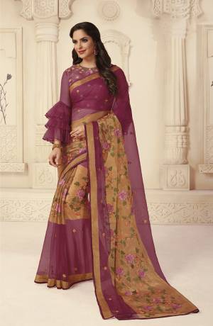New Shade IS Here To Add Into Your Wardrobe With This Designer Saree In Wine Color. This Saree Is Brasso Fabricated Paired With Art Silk Fabricated Blouse. 