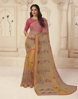 Simple And Elegant Looking Saree Is Here In Beige Color Paired With Pink Colored Blouse. This Saree Is Fabricated On Brasso Paired With Art Silk Blouse. Both Its Fabric Also Gives A Rich Look To Your Personality. 
