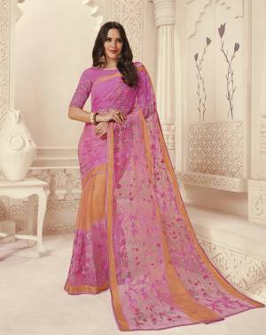Grab This Pretty Saree In Powder Pink Color Paired With Powder Pink Colored Blouse. This Saree IS Brasso Based Paired With Silk based Blouse. It Has Pretty Thread Work Over The Saree And Blouse. 