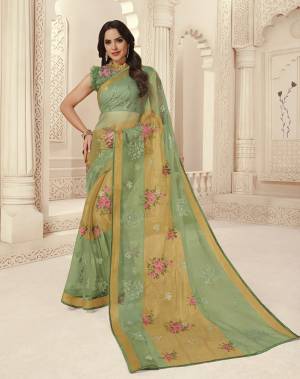 Look Lovely In This Pretty Shade Of Green With This Designer Saree In Light Green Color Paired With Light Green Colored Blouse. This Saree Is Fabricated On Brasso Paired With Art Silk Fabricated Blouse. Buy Now.