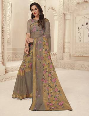 Simple And Elegant Looking Saree Is Here In Grey Color Paired With Grey Colored Blouse. This Saree Is Fabricated On Brasso Paired With Art Silk Blouse. Both Its Fabric And Color Gives A Rich Look To Your Personality. 
