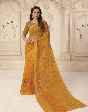 Grab This Pretty Saree In Musturd Yellow Color Paired With Musturd Yellow Colored Blouse. This Saree IS Brasso Based Paired With Silk based Blouse. It Has Pretty Thread Work Over The Saree And Blouse. 