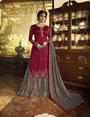 Beautiful Combination Is Here With A Light And Dark Color Pallete.Grab This Designer Semi-Stitched Suit In Magenta Pink Coored Top Paired With Contarsting Grey Colored Bottom And Dupatta. Its Top Is Fabricated On Satin Georgette Paired With Georgette Fabricated Bottom And Dupatta. All Its Fabrics Are Light Weight And Easy To Carry All Day Long. 
