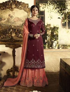 If You Have An Eye For Colors, Than Grab This Designer Semi-Stitched Suit In Maroon Colored Top Paired With Contrasting Peach Colored Bottom And Dupatta. Its Top Is Fabricated On Satin Georgette Paired With Georgette Bottom And Dupatta. Get This Tailored As Per Your Desired Fit And Comfort. 