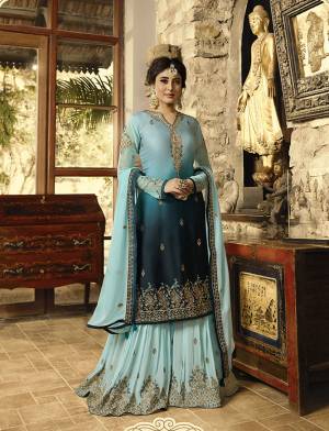 Go With The Shades Of Blue With This Designer Semi-Stitched Suit In Shaded Aqua Blue And Navy Blue Colored Top Paired With Navy Blue Colored Bottom And Dupatta. Its Top Is Fabricated On Satin Georgette Paired With Georgette Based Bottom And Dupatta. Buy Now.