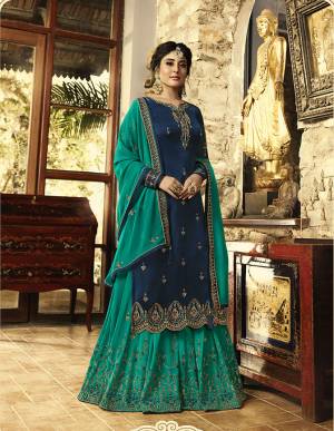 Enhance Your Personality Wearing This Designer Semi-Stitched Suit In Navy Blue Colored Top Paired With Contrasting Sea Green Colored Bottom And Dupatta. Its Top Is Fabricated On Satin Georgette Paired With Georgette Fabricated Bottom And Dupatta. Buy Now.