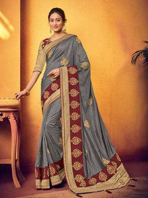 Get this amazing saree and look pretty like never before. wearing this grey color two tone silk fabrics saree. look gorgeous at an upcoming any occasion wearing the saree. this party wear saree won't fail to impress everyone around you. Its attractive color and designer floral design, stone, patch work over the attire & contrast hemline adds to the look. Comes along with a contrast unstitched blouse.