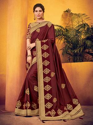 Flaunt your gorgeous look wearing this maroon color two tone silk fabrics saree. this gorgeous saree featuring a beautiful mix of designs. look gorgeous at an upcoming any occasion wearing the saree. Its attractive color and designer floral design, stone work over the attire & contrast hemline adds to the look. Comes along with a contrast unstitched blouse.