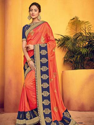 You Look elegant and stylish this festive season by draping this orange color two tone silk fabrics saree. Ideal for party, festive & social gatherings. this gorgeous saree featuring a beautiful mix of designs. Its attractive color and designer floral design, stone work over the attire & contrast hemline adds to the look. Comes along with a contrast unstitched blouse.