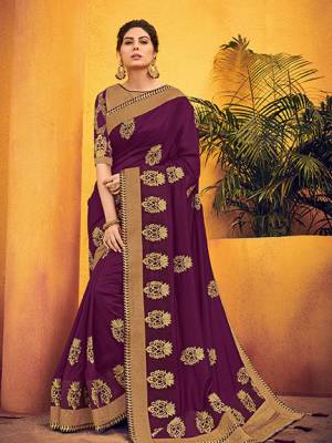 Wear this Wine color two tone silk fabrics saree. this party wear saree won't fail to impress everyone around you. this gorgeous saree featuring a beautiful mix of designs. Its attractive color and designer floral design, stone work over the attire & contrast hemline adds to the look. Comes along with a contrast unstitched blouse.