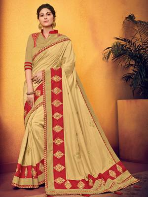 marvelously charming is what you will look at the next wedding gala wearing this beautiful beige color two tone silk fabrics saree. this gorgeous saree featuring a beautiful mix of designs. look gorgeous at an upcoming any occasion wearing the saree. Its attractive color and designer floral design, stone work over the attire & contrast hemline adds to the look. Comes along with a contrast unstitched blouse.
