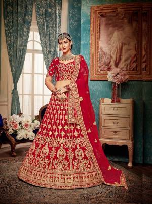 Get Ready For Your Big Day With This Heavy Designer Lehenga Choli?In Red Color. This Heavy Embroidered Lehenga Choli Is Fabricated On Velvet Paired With Net Fabricated Dupatta. It Is Beautified With Heavy Jari & Thread Embroidery and Stone Work. Buy Now