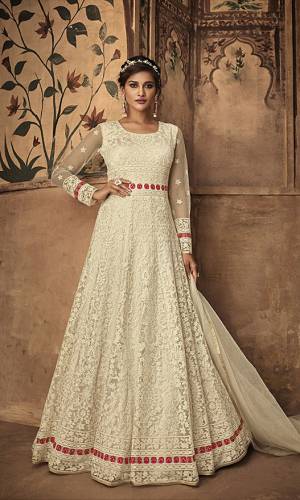 Simple And Elegant Looking Heavy Designer Floor Length Suit Is Here In Off-White Color Paired With Off-White Colored Bottom And Dupatta. Its Embroidered Top Is Fabricated On Net Paired With Satin Bottom And Net Fabricated Dupatta. 