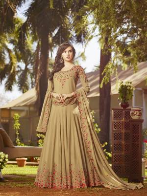 Simple And Elegant Looking Designer Floor Length Suit Is Here In Beige Color Paired With Beige Colored Bottom And Dupatta. Its Top And Dupatta Are Georgette Fabricated Beautified With Contrasting Embroidery Paired With Santoon Bottom. It Is Light In Weight And Easy To Carry All Day Long. 