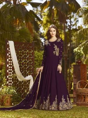 Eye Catchy And Trendy Color Is Here With This Designer Floor Length Suit In Dark Purple Color Paired With Dark Purple Colored Bottom And Dupatta. Its Top And Dupatta Are Fabricated On Georgette Paired With Santoon Bottom. It Is Beautified With Attractive Embroidery. Buy Now.
