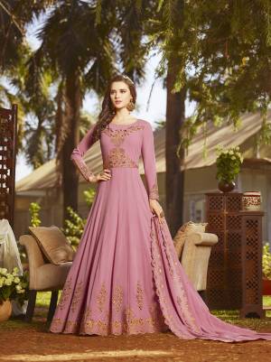 Look Pretty Wearing This Designer Floor Length Suit In Pink Color Paired With Pink Colored Bottom And Dupatta. Its Top And Dupatta Fabricated On Georgette Beautified With Heavy Contrasting Embroidery Paired With Santoon Bottom. Buy Now.