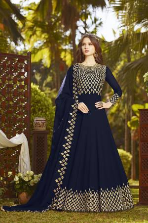 Enhance Your Personality Wearing This Heavy Designer Floor Length Suit In Rich Navy Blue Color Paired With Navy Blue Colored Bottom And Dupatta. It Top And Dupatta Are Georgette Fabricated Beautified With Heavy Embroidery Paired With Santoon Fabricated Bottom. Buy This Semi-Stitched Suit Now.
