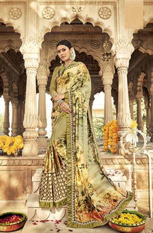Grab This Pretty Designer Saree In Light Green Color Paired With Light Green Colored Blouse. This Saree Is Fabricated On Satin Georgette And Net Paired With Art Silk Fabricated Blouse. It Is Beautified With Bold Floral Prints And Embroidered Lace Border. Buy Now.