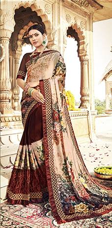 Grab This Pretty Designer Saree In Beige And Brown Color Paired With Brown Colored Blouse. This Saree Is Fabricated On Satin Georgette And Net Paired With Art Silk Fabricated Blouse. It Is Beautified With Bold Floral Prints And Embroidered Lace Border. Buy Now.