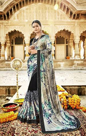 You Will Definitely Earn Lots Of Compliments In This Unique Patterned Designer Saree In Grey And Black Color Paired With Black Colored Blouse. This Saree Is Fabricated On Satin Georgette And Net Paired With Art Silk Blouse. Buy This Designer Saree Now. 