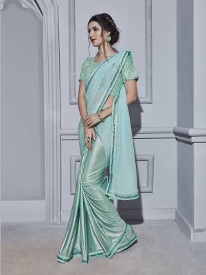 Here Is A Very Pretty Shade With This Ready To Wear Saree In Aqua Blue Color Paired With Aqua Blue Colored Blouse. This Saree And Blouse Are Fabricated On Fancy Fabric Beautified With Attractive Pearls Over The Blouse. 