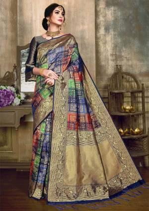 Go Colorful With This Designer Silk Based Saree In Multi Color Paired With Navy Blue And Gold Colored Blouse. This Saree And Blouse Are Fabricated On Banarasi Poly Silk Beautified With Heavy Weave All Over. 