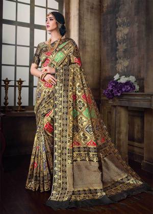 Go Colorful With This Designer Silk Based Saree In Multi Color Paired With Black And Gold Colored Blouse. This Saree And Blouse Are Fabricated On Banarasi Poly Silk Beautified With Heavy Weave All Over. 