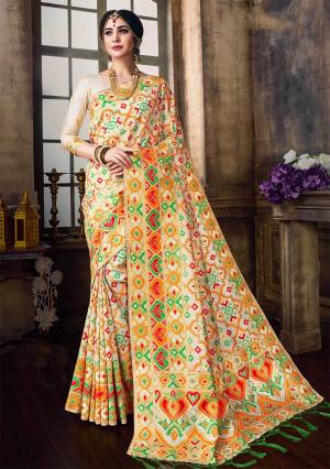 Rich And Elegant Looking Silk Based Saree Is Here In Cream Color Paired With Cream Colored Blouse. This Saree And Blouse Are Fabricated On Banarasi Poly Silk Beautified With Multi Colored Weave All Over. 