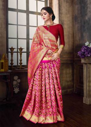 Look Pretty Wearing This Saree In Pretty Pink And Red Color Paired With Red Colored Blouse. This Saree And Blouse Are Fabricated On Banarasi Poly Silk Beautified  With Weave. It Is Durable And Easy To Drape. 