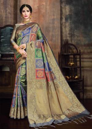Go Colorful With This Designer Silk Based Saree In Multi Color Paired With Grey And Gold Colored Blouse. This Saree And Blouse Are Fabricated On Banarasi Poly Silk Beautified With Heavy Weave All Over. 