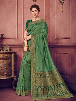 Vibrant and visually appealing, this green color two tone silk fabrics saree. Ideal for party, festive & social gatherings. this gorgeous saree featuring a beautiful mix of designs. Its attractive color and heavy designer embroidered saree, sequence design, stone design, beautiful floral design all over work over the attire & contrast hemline adds to the look. Comes along with a contrast unstitched blouse.