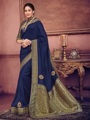 Look gorgeous in this beautiful printed Navy Blue color two tone silk fabrics saree. Ideal for party, festive & social gatherings. this gorgeous saree featuring a beautiful mix of designs. Its attractive color and heavy designer embroidered saree, patch design, beautiful floral design all over work over the attire & contrast hemline adds to the look. Comes along with a contrast unstitched blouse.
