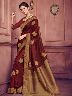 The fabulous pattern makes this saree a classy number to be included in your wardrobe. maroon color two tone silk fabrics saree. Ideal for party, festive & social gatherings. this gorgeous saree featuring a beautiful mix of designs. Its attractive color and heavy designer embroidered saree, patch design, beautiful floral design all over work over the attire & contrast hemline adds to the look. Comes along with a contrast unstitched blouse.