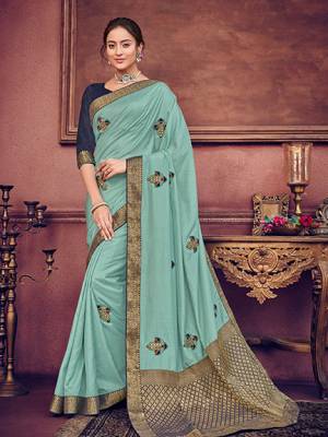 Wear this Aqua Blue color two tone silk fabrics saree. Ideal for party, festive & social gatherings. this gorgeous saree featuring a beautiful mix of designs. Its attractive color and heavy designer embroidered saree, patch design, beautiful floral design all over work over the attire & contrast hemline adds to the look. Comes along with a contrast unstitched blouse.