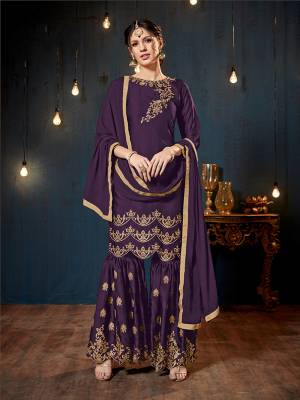 Get Ready For The Upcoming Festive And Wedding Season With This Heavy Designer Sharara Suit In Purple Color. Its Top And Bottom Are Fabricated On Satin Georgette Paired With Chiffon Fabricated Dupatta. It Is Beautified Heavy Embroidery Over The Top And Bottom Both. 