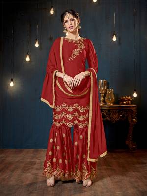 Get Ready For The Upcoming Festive And Wedding Season With This Heavy Designer Sharara Suit In Red Color. Its Top And Bottom Are Fabricated On Satin Georgette Paired With Chiffon Fabricated Dupatta. It Is Beautified Heavy Embroidery Over The Top And Bottom Both. 