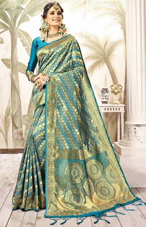Grab This Designer Silk Based Saree For The Upcoming Festive And Wedding Season With This Saree In Blue And Gold Paired With Blue Colored Blouse. This Saree Is Fabricated On Kanjivaram Art Silk Paired With Art Silk Fabricated Blouse. Buy Now.