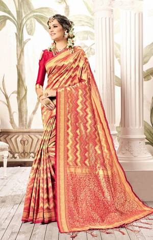 This Festive Season, Look The Amazing Of All In This Silk Based Red And Gold Colored Saree Paired With Red Colored Blouse. This Saree Is Fabricated On Kanjivaram Art Silk Paired With Art Silk Fabricated Blouse. 