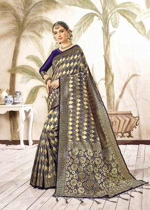 Shine Bright Wearing This Designer Silk Based Saree In Navy Blue And Gold Paired With Navy Blue Colored Blouse. This Saree Is Fabricated On Kanjivaram Art Silk Paired With Art Silk Fabricated Blouse. It Is Beautified With Weave All Over. 