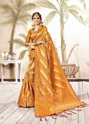 Grab This Designer Silk Based Saree For The Upcoming Festive And Wedding Season With This Saree In Musturd Yellow And Gold Paired With Musturd Yellow Colored Blouse. This Saree Is Fabricated On Kanjivaram Art Silk Paired With Art Silk Fabricated Blouse. Buy Now.