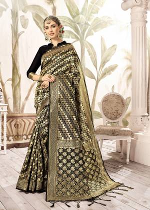 For A Bold And Beautiful Look, Grab This Designer Silk Based Saree In Black And Gold Paired With Black Colored Blouse. This Saree Is Fabricated On Kanjivaram Art Silk Paired With Art Silk Fabricated Blouse. It Is Beautified With Weave All Over It.Buy Now.