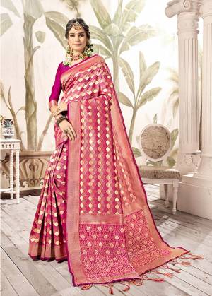 This Festive Season, Look The Amazing Of All In This Silk Based Magenta Pink And Gold Colored Saree Paired With Magenta Pink Colored Blouse. This Saree Is Fabricated On Kanjivaram Art Silk Paired With Art Silk Fabricated Blouse. 