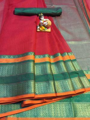 Grab This Rich Looking Saree In Red Color Paired With Contrasting Dark Green Colored Blouse. This Saree And Blouse Are Fabricated On Cotton Silk Which Gives A Rich Look To Your Personality. 