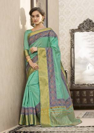Look Pretty In This Pretty Girly Color Pallete With This Saree In Sea Green Color Paired With Sea Green Colored Blouse. This Saree And Blouse are Fabricated On Art Silk Beautified With Printed Lace Border. 